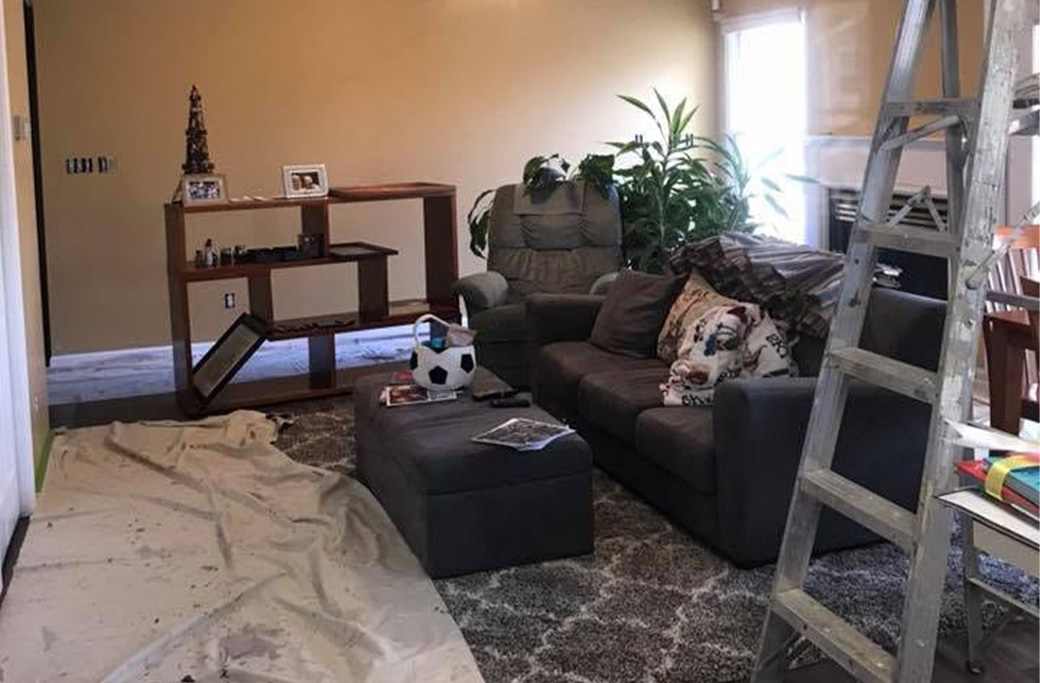Interior room prepared for painting with floors and furniture protected